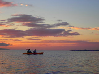 Wrapped in a red sunset… the twilight sunset canoe tour